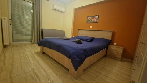 a bedroom with a bed with a cat laying on it at Athens Luxury Home * Private Parking * Attica Metro Station in Athens
