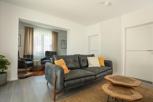a living room with a couch and a table at Kuća sa bazenom do 10 osoba Freedom Place in Jagodina