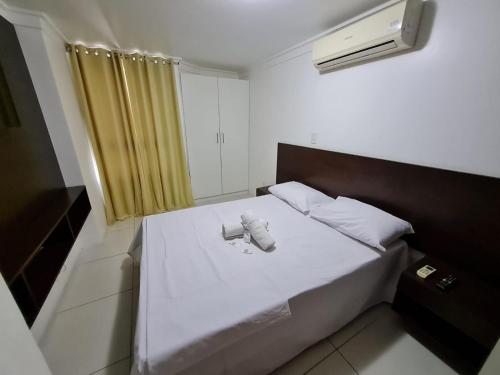 Giường trong phòng chung tại Luxor Tambaú