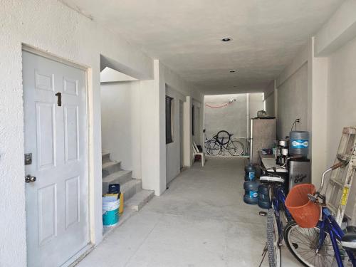 a hallway with a bike parked in a house at El Padrino in Akumal