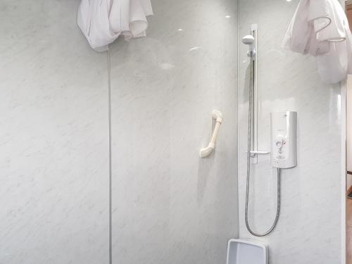 a shower in a bathroom with a glass door at Buchanan Park in Ceres