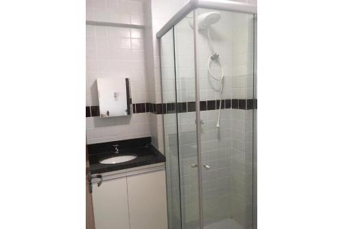 a bathroom with a shower and a sink at Vela e Mar in Nossa Senhora do Livramento