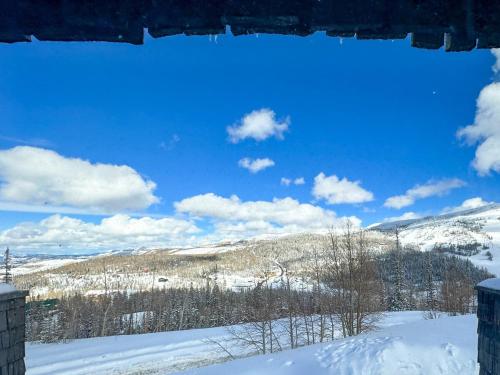 a view of a snowy mountain with a blue sky at Eagle Roost Retreat By Ski Lifts in Brian Head