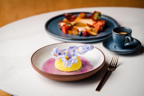 a plate of food on a table with a plate of food at Le Centre Sheraton Montreal Hotel in Montréal