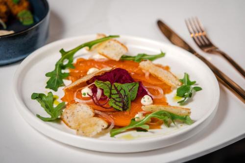 a white plate of food on a table at Le Centre Sheraton Montreal Hotel in Montréal