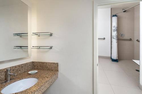 a bathroom with a sink and a mirror at Residence Inn by Marriott New Orleans Metairie in Metairie