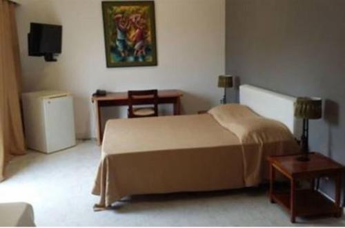 Postel nebo postele na pokoji v ubytování Archotel