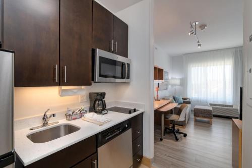 a kitchen with a sink and a counter top at TownePlace Suites by Marriott Dallas McKinney in McKinney