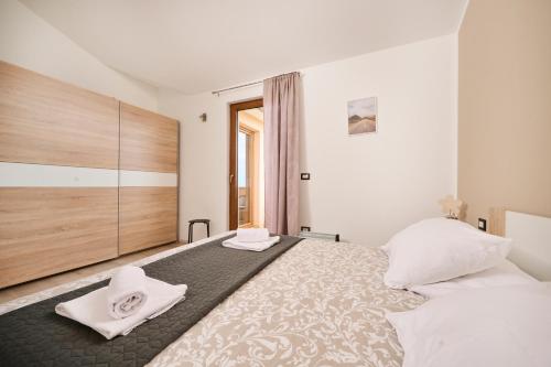Postel nebo postele na pokoji v ubytování Apartman Aisha