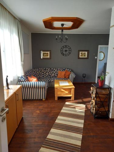 a living room with a couch and a table at Burgblick-Hardegg in Hardegg