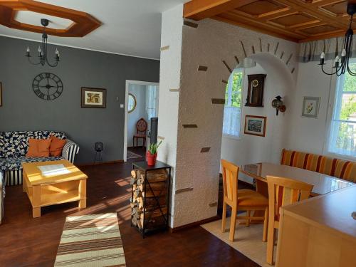 a living room with a kitchen and a dining room at Burgblick-Hardegg in Hardegg