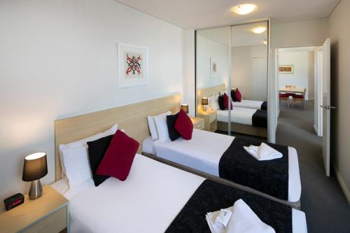 Mantra Castle Hill Sydney, an Accor Hotelにあるベッド