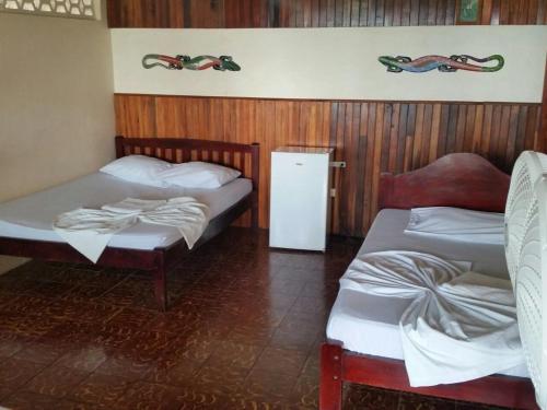 Katil atau katil-katil dalam bilik di Hotel Cabinas Mar Y Cielo