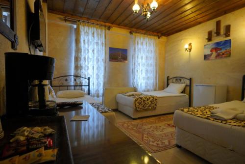 Goreme Cave Rooms&Poolにあるベッド