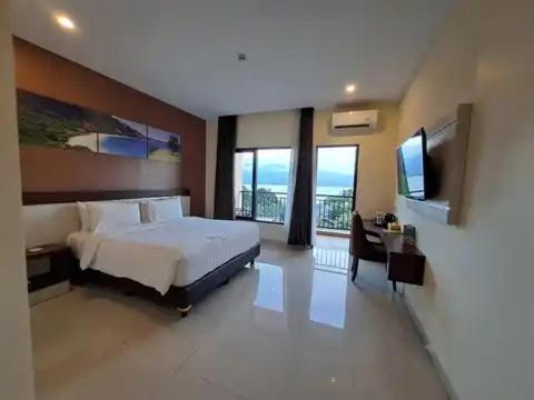 Кровать или кровати в номере Hotel Simfony Alor
