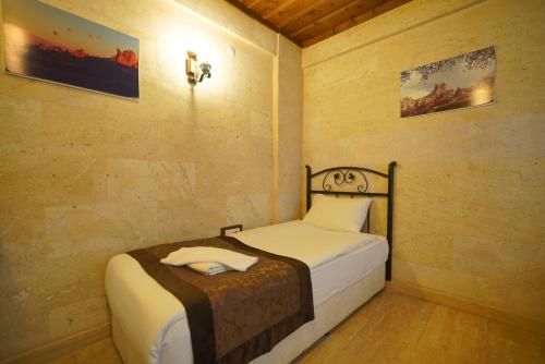 Goreme Cave Rooms&Poolにあるベッド
