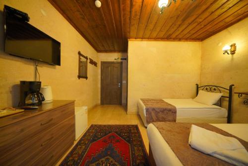 Goreme Cave Rooms&Poolにあるベッド