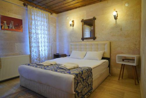 Goreme Cave Rooms&Poolにあるベッド
