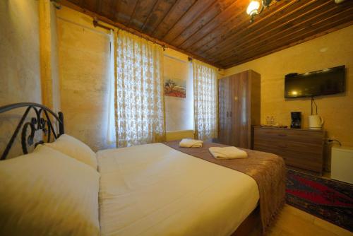 Goreme Cave Rooms&Poolにあるベッド