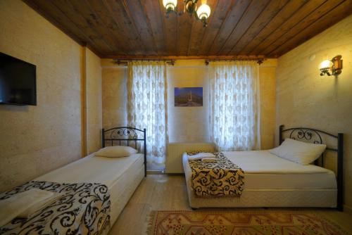 Goreme Cave Rooms&Poolにあるベッド