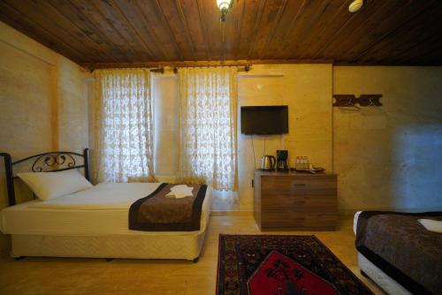 Goreme Cave Rooms&Poolにあるベッド