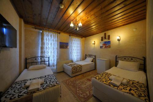 Goreme Cave Rooms&Poolにあるベッド