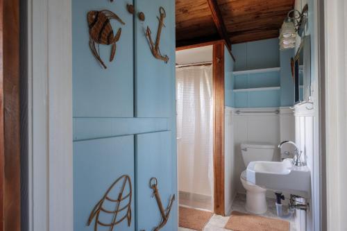 a bathroom with a toilet and a sink at Pounds Cottage, 1 Bedroom, Sleeps 4, Ocean Front, Pet Friendly in Butler Beach