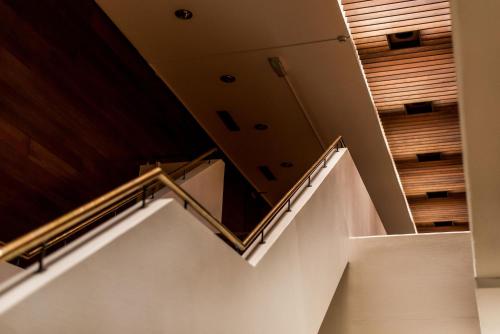 a staircase in a house with wooden ceilings at Billingehus in Skövde