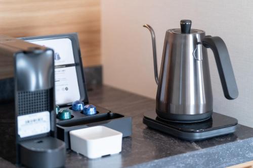 オーセントホテル小樽にあるコーヒーまたはお茶
