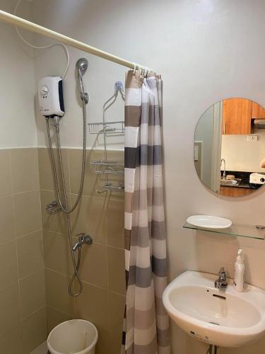 a bathroom with a shower and a sink at Studio unit at The Loop in Cagayan de Oro