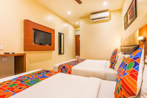 Postel nebo postele na pokoji v ubytování FabHotel Liwa International - Nr Mumbai International Airport