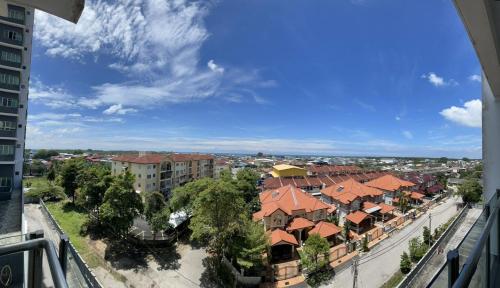 a view from a balcony of a city with houses at Countryside Condo @One Residence Sekinchan in Sekincan