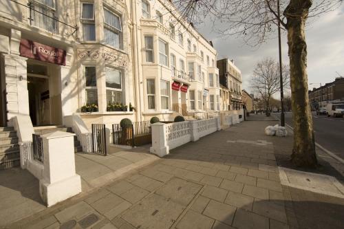a building on the side of a city street at Royal London Hotel By Saba in London