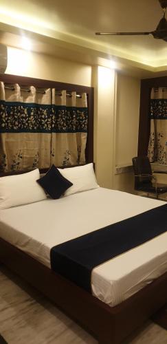 Postel nebo postele na pokoji v ubytování Imperial Plaza Guest House