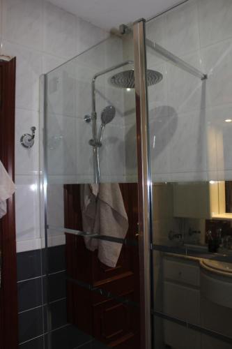 a shower with a glass door in a bathroom at Vibes Coruña-Finisterre 288 in A Coruña
