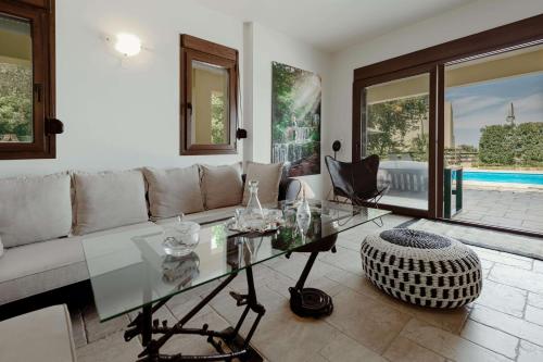 a living room with a couch and a table at Villa Emma in Gerani