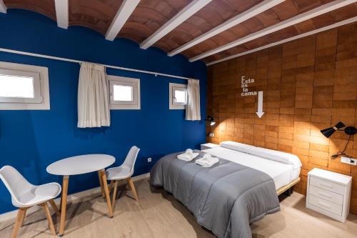 Ένα ή περισσότερα κρεβάτια σε δωμάτιο στο Apartamentos Turísticos DE LA BERNARDA