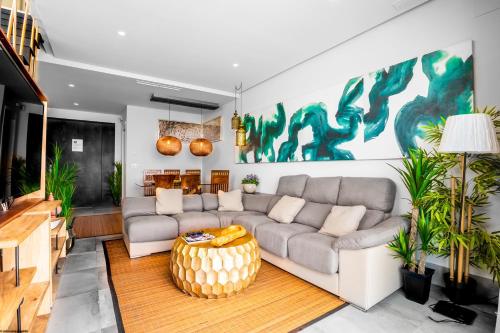 a living room with a couch and a table at ON Village in Matalascañas