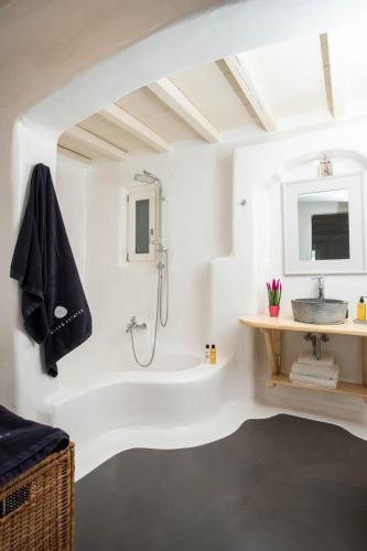 a bathroom with a shower and a sink at Villa Jet by Mykonos Rocks in Mikonos