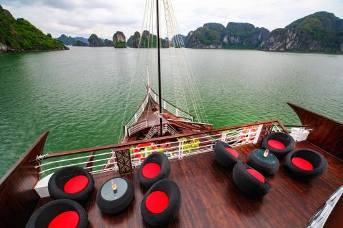 a boat with a bunch of seats on the deck at V'Spirit Cruise in Ha Long