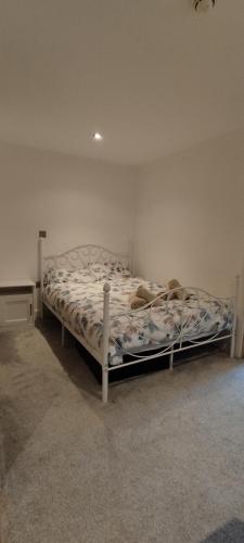 a bedroom with a bed in a white room at Earl Street 122 in Sheffield