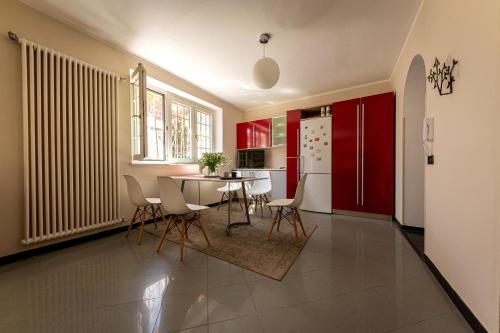 a kitchen and dining room with a table and chairs at San Gaudenzio 16 in Ivrea