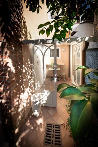 a view of a room with a table and a mirror at San Gaudenzio 16 in Ivrea