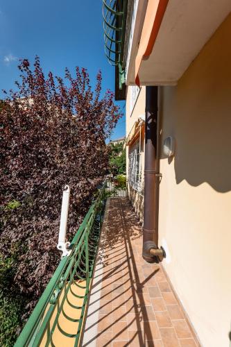 a balcony with a fence next to a building at San Gaudenzio 16 in Ivrea