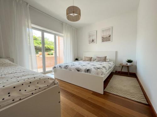 En eller flere senge i et værelse på Varanda Rosa da Baía