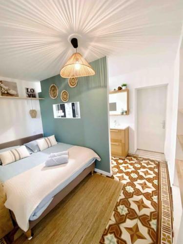 a bedroom with a large bed with a ceiling at Logement T2 ICADE ADP Orly Lenôtre JMonnet JMermoz in Rungis