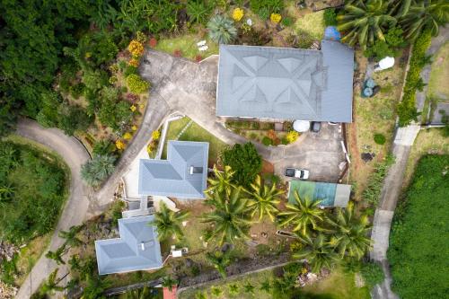 an overhead view of a house with trees and a yard at OCEAN VISTA in Au Cap