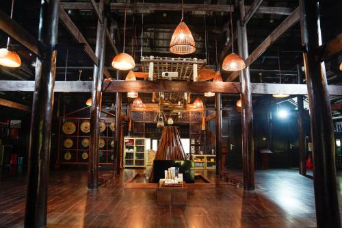 a large room with a couch and some lights at MEDDOM Park in Cao Phong