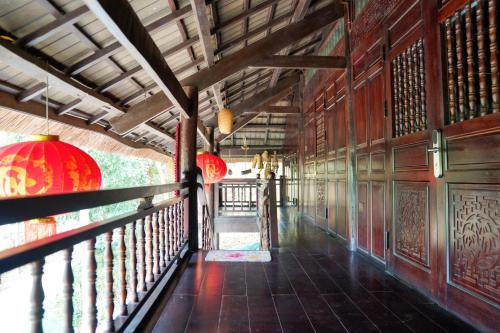 a hallway in a building with red lanterns on it at MEDDOM Park in Cao Phong