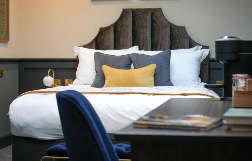 Katil atau katil-katil dalam bilik di Hort's Townhouse